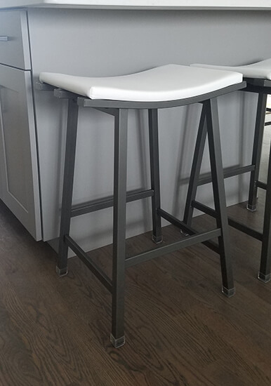 Amisco's Nathan Backless Saddle Stool in Dark Gray and White Vinyl