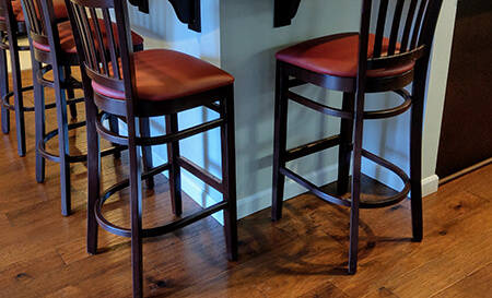 Holland's 3120 Hampton Wooden Stationary Barstool with Vertical Slats on Back and Seat Cushion in Customer Kitchen