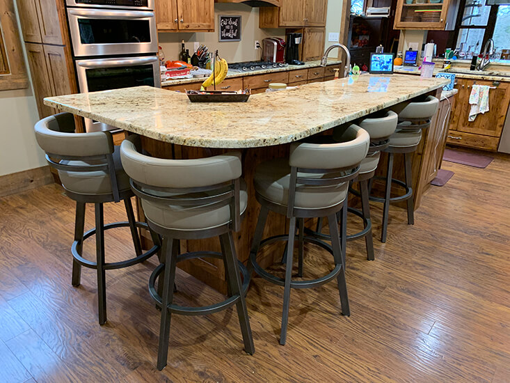 Wesley Allen's Miramar Upholstered Swivel Bar Stools with Low Back in Traditional Large Kitchen