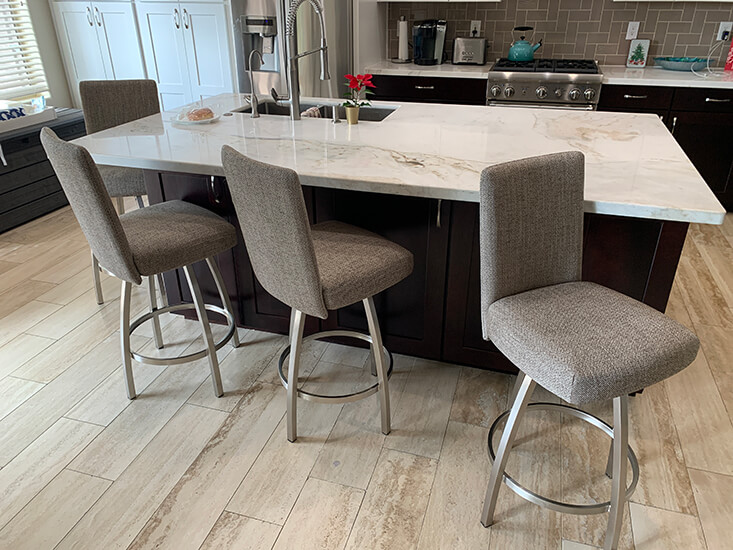 Trica's Nicholas Swivel Counter Stools in Brushed Steel and Tan Upholstery in Modern Kitchen