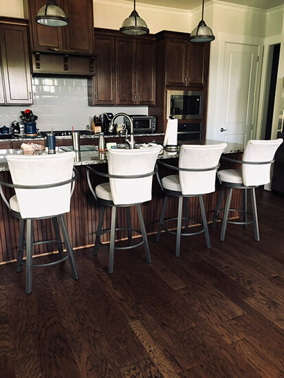 Amisco's Cardin Swivel Counter Bar Stools with Arms in Gray Metal Finish and White Seat Cushion in Traditional Kitchen