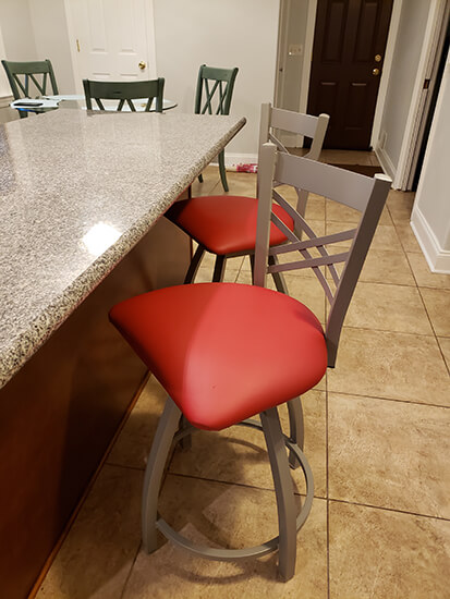 Holland's Catalina XL Swivel Counter Stools with Cross-Back Design and Red Seat in Kitchen