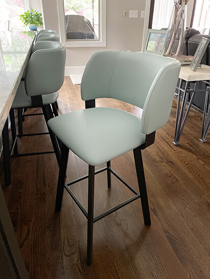 Amisco's Easton Dark Brown Swivel Counter Stools with Seafoam Green Seat and Back in Modern Kitchen