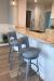 Amisco's Brock Swivel Bar Stools in Silver Metal and Blue Seat/Back Cushion in Kitchen Island with White Cabinets